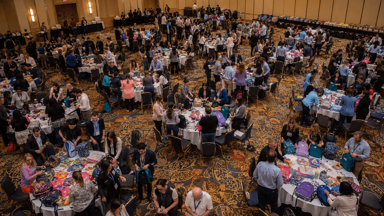 Corporate teams assembling care packages at Operation You Matter